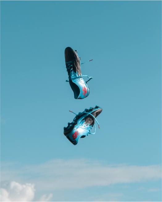 Football boots thrown in the air